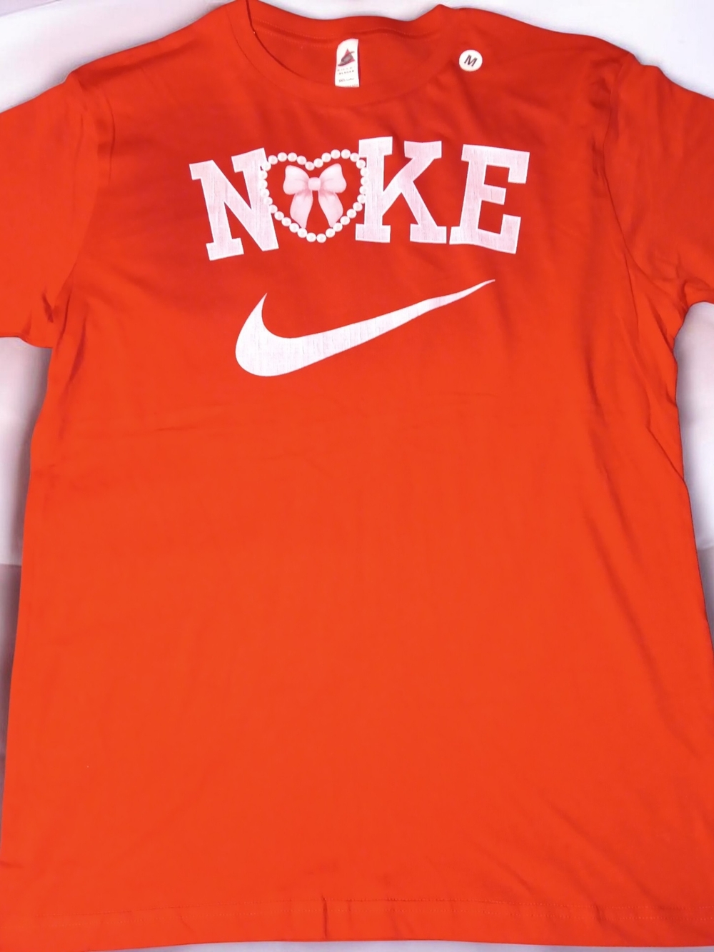 Nike Orange Tee with White Logo and Heart Graphic